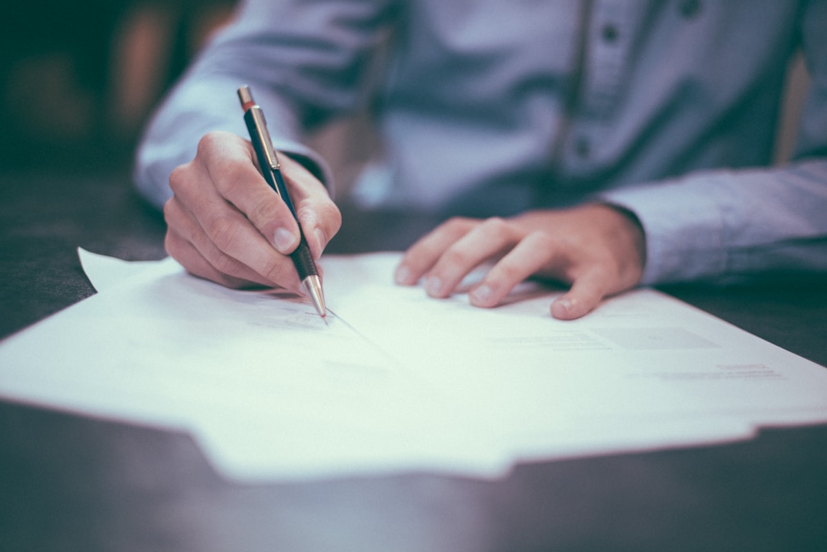 Homeowner signing customized contractor proposal using e-signature on tablet