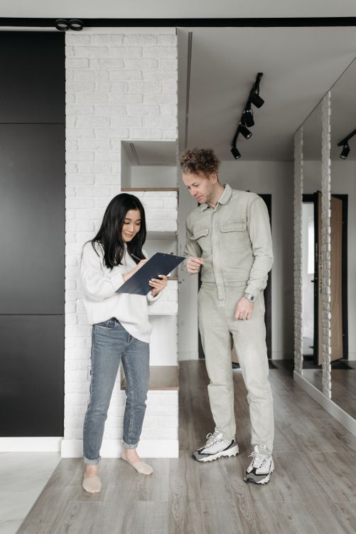 HVAC technician consulting homeowner — best hvac software for contractors streamlines field service management and customer communication