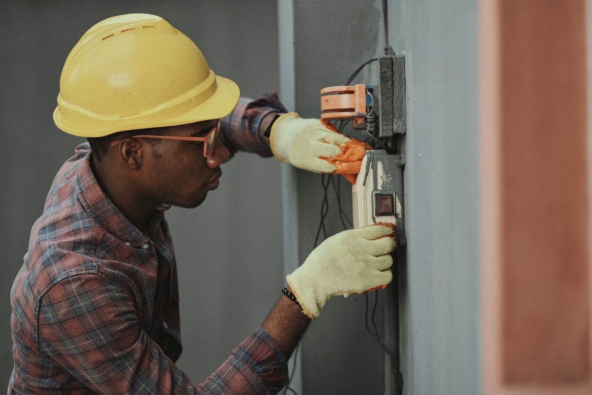 HVAC technician performing system installation — field service management and gps tracking with best hvac software for contractors
