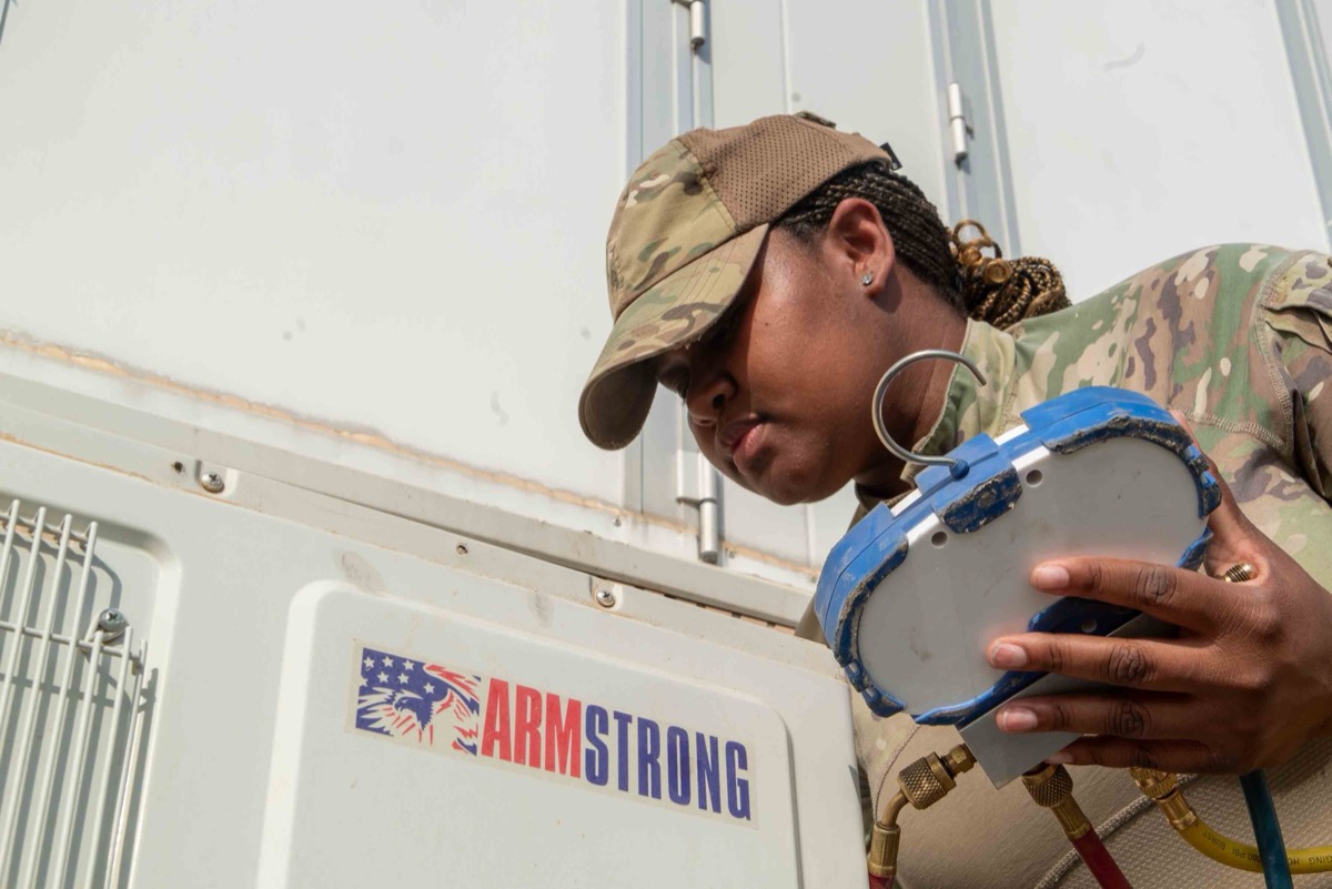Best HVAC software for contractors — HVAC technician crew installing and servicing HVAC systems