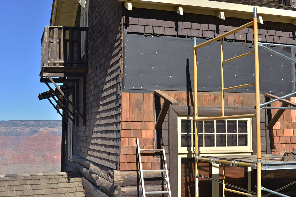 Best roofing CRM software — roofing contractor crew completing residential roof renovation project