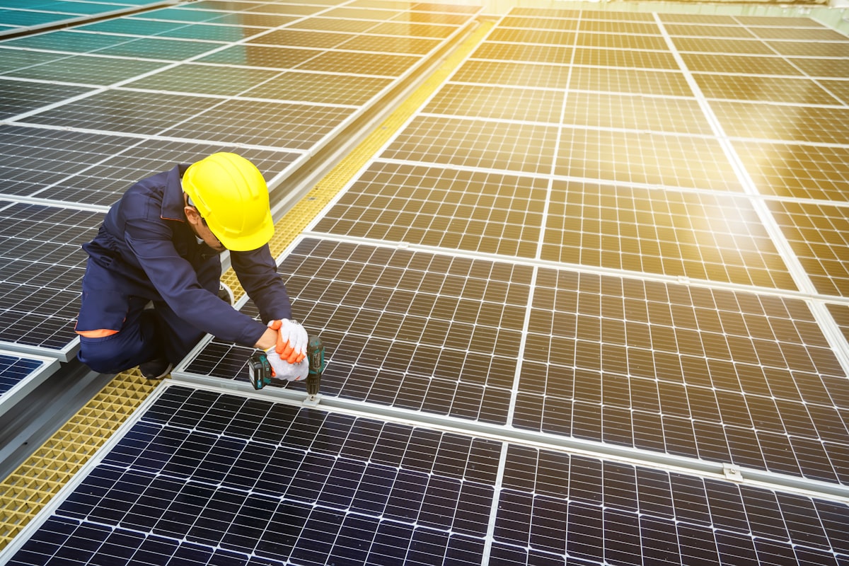 Solar installation crew on rooftop — best solar financing software connects the sale to project management after approval
