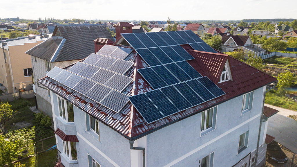 Best solar proposal software — residential solar panel installation on rural country home rooftop
